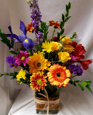 "Burst of Autumn Bouquet"...(F).. seasonal mixed  bright fall flowers arranged in a rectangular vase with ribbbon detail! 