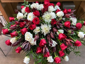 SAFARI SUNSET CASKET SPRAY Floral Arrangement