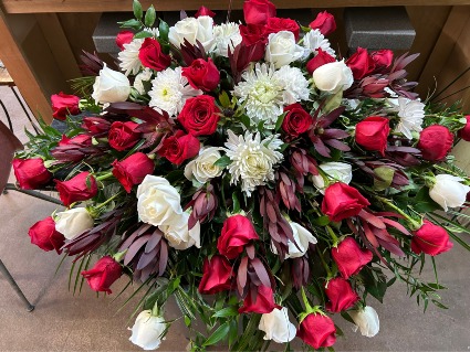 SAFARI SUNSET CASKET SPRAY Floral Arrangement