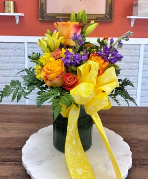 Shahidah’s Sunset surprise  Tall clear vase with aspidistra leaf 