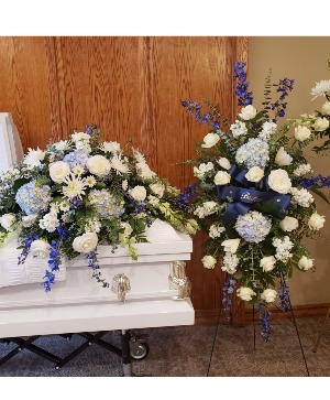 Soft blue goodbye Casket spray with matching standing spray