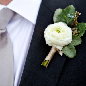 Soft White Ranunculus Boutonniere 