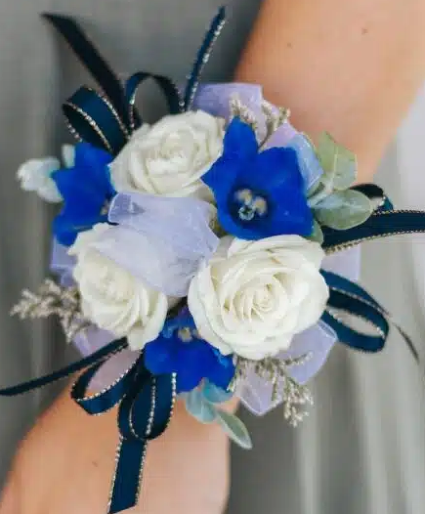 Spray roses and delphinium corsage  Wristlet corsage 