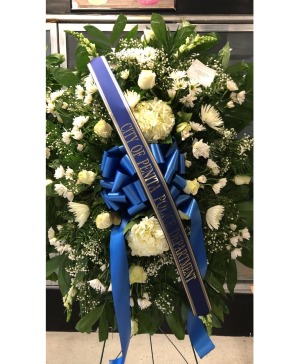 STANDING SPRAY: All white with royal blue bow 