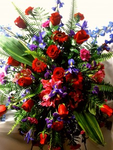 Standing spray with shades of Blues Reds and (S) Purples.