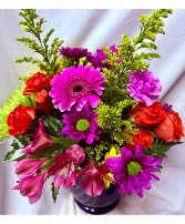 SUMMER GLOW… bright flowers, arranged in (E) Vase with seasonal filler flowers. yellows, orange,pinks,purples!