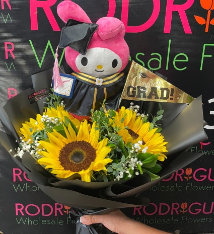 Sunflower grad Bouquet teddy bear may be substituted with a different teddy bear depending on availability.