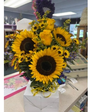 Sunflowers and roses vased
