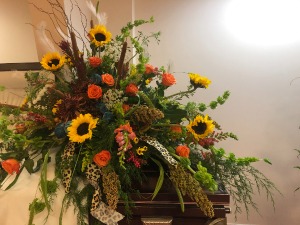 Sunflowers with a Twist casket spray