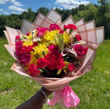 Sweet pink and yellow mixed flower arrangement  Wrapped