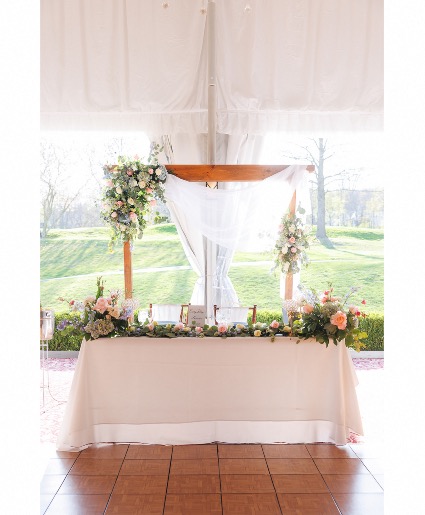 Sweetheart table  Reception flowers 