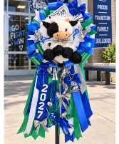 The Blue Ribbon Moo Homecoming Mum Call Us for Faster Service & Daily Specials: (915) 303-8500 Text Us to Order Anytime: (915) 505-3708 Your trusted source for Flowers & Delivery in El Paso TX 