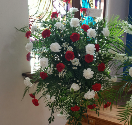 Standing Spray with Red and White carnations (S) And seasonal filler.