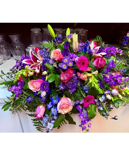 Vibrant casket spray  
