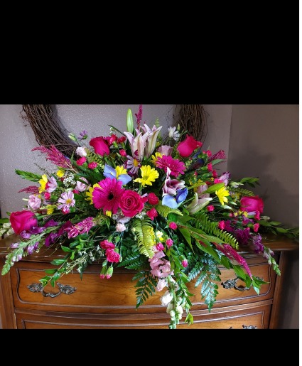 Vibrant casket spray Sympathy 