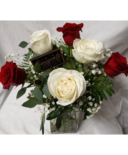3 red and 3 white roses arranged in a vase (R) with a CONGRATS pick!
