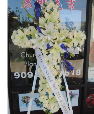 White and Blue Cross  Funaral Spray