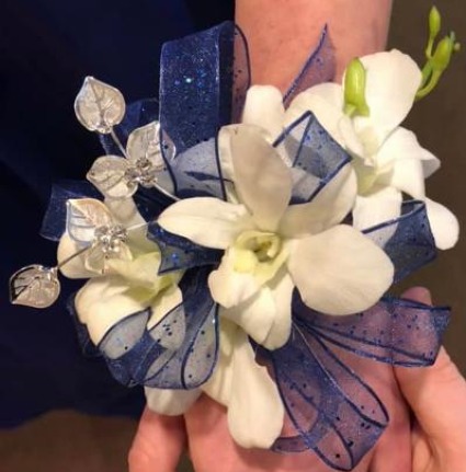 white and blue wrist corsage 