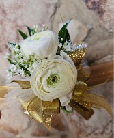 White and gold with ranunculus wrist corsage