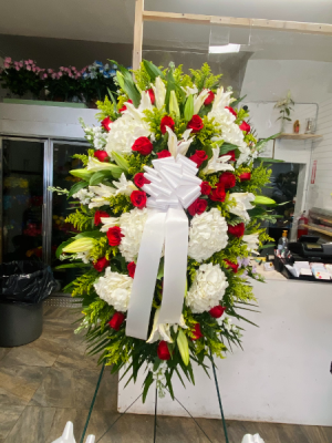 White flower with red roses Our thoughts and prayers are with you
