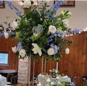 white rose and blue tweedia center pieces 