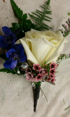 White rose, Blue delphinum & waxflower Boutonniere