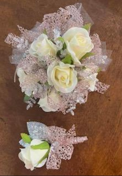 white rose lt. pink corsage and boutonniere 