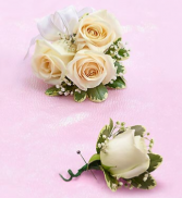 White sweetheart rose corsage with  matching bout! 