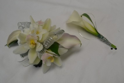 white wrist with matching boutonnier wrist corsage