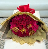 Red & pink roses with butterflies wrapped in black paper