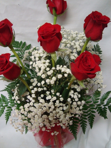(R)  "Best Seller" Six Red Roses arranged in a  vase with baby's breath or wax flower. 