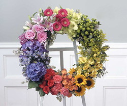WRlEATH SUNSET ARRANGEMENT OF FLOWERS 