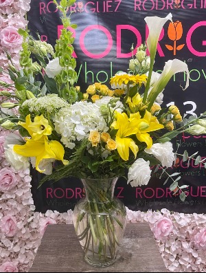 Yellow, green, and white flower arrangement  *calla lilies are sold out* Flowers included: Lilys, mini roses, hydrangeas, etc.